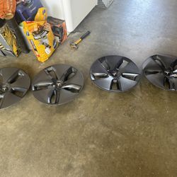 4 Tesla Aero Covers $75.  One year old. Put on new rims don't need them anymore