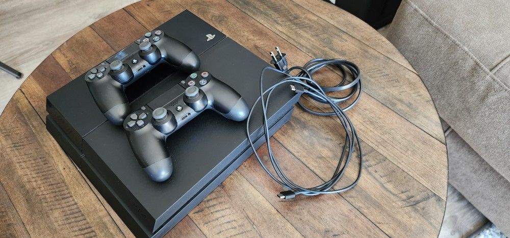 PS4 w/ 2 Controllers And Games