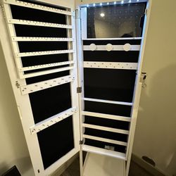 Jewelry display case with mirror.