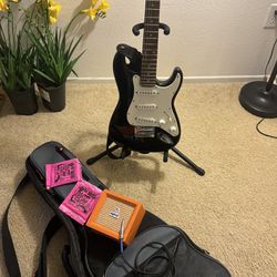 Fender guitar And Bag With Stand And Amp And Strings 