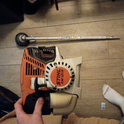 Stihl brand version chainsaw and weed wacker combination