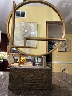 THIS UTTERMOST DESIGNER MIRROR THAT INSTANTANEOUSLY PROVIDES AN ARTISTIC FEEL TO ANY AREA IN A  HOME THAT THE DESIGNER MIRROR IS PLACED!