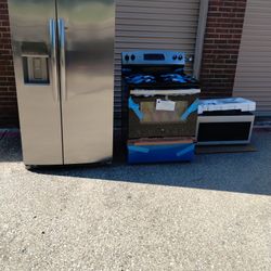 Side By Side Refrigerator And Electric Stove Microwave 