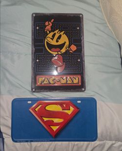 Pac-Man Tin Sign and Superman License Plate