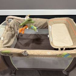 Carters Safari Pack N Play With Changing And Diaper Storage