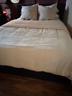 Malm queen bed frame with adjustable base. Mattress not included
