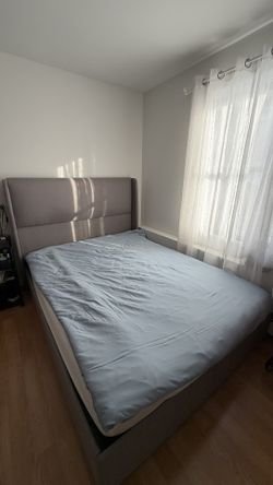Queen Size Bed In Grey Color And A Mattress