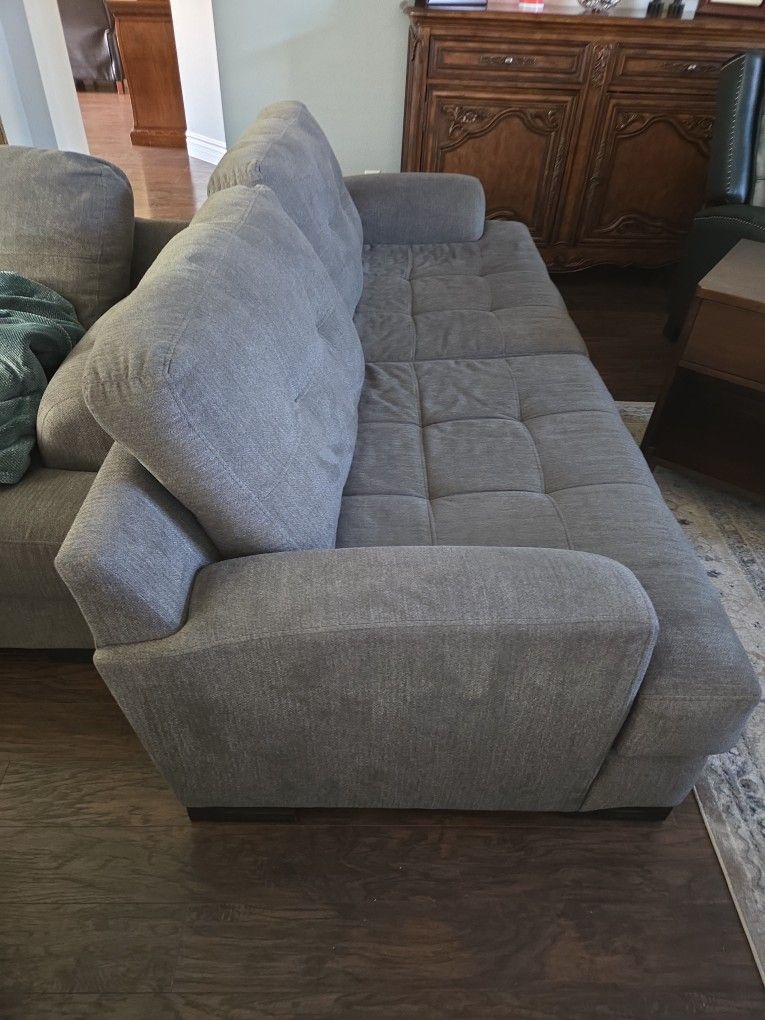Two Identical Sofas In Good Condition 