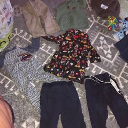 Bag of baby boy clothes, seven items in the bag