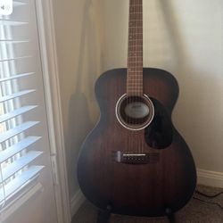 Mitchell guitar with stand