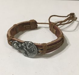 Brown leather bracelet with silver jesus and mary charm