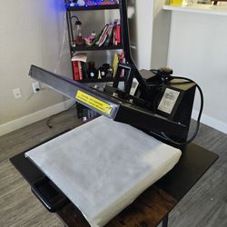 Heat press machine for shirts or others.