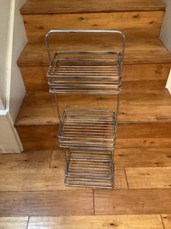 3- Shelves Metal Shelf.  Dimensions are; 29”H—9”W—6-1/2”D.