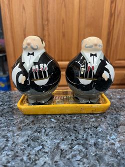 Ceramic Butler Waiter Pair of Salt and Pepper Shakers with tray.  Size approximately 4 1/2 inches tall.  Brand new never used.  Has been on display in