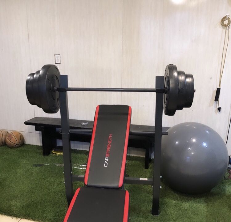 Gym Equipment Adjustable Bench press, barbell, leg developer and 100lbs of weight