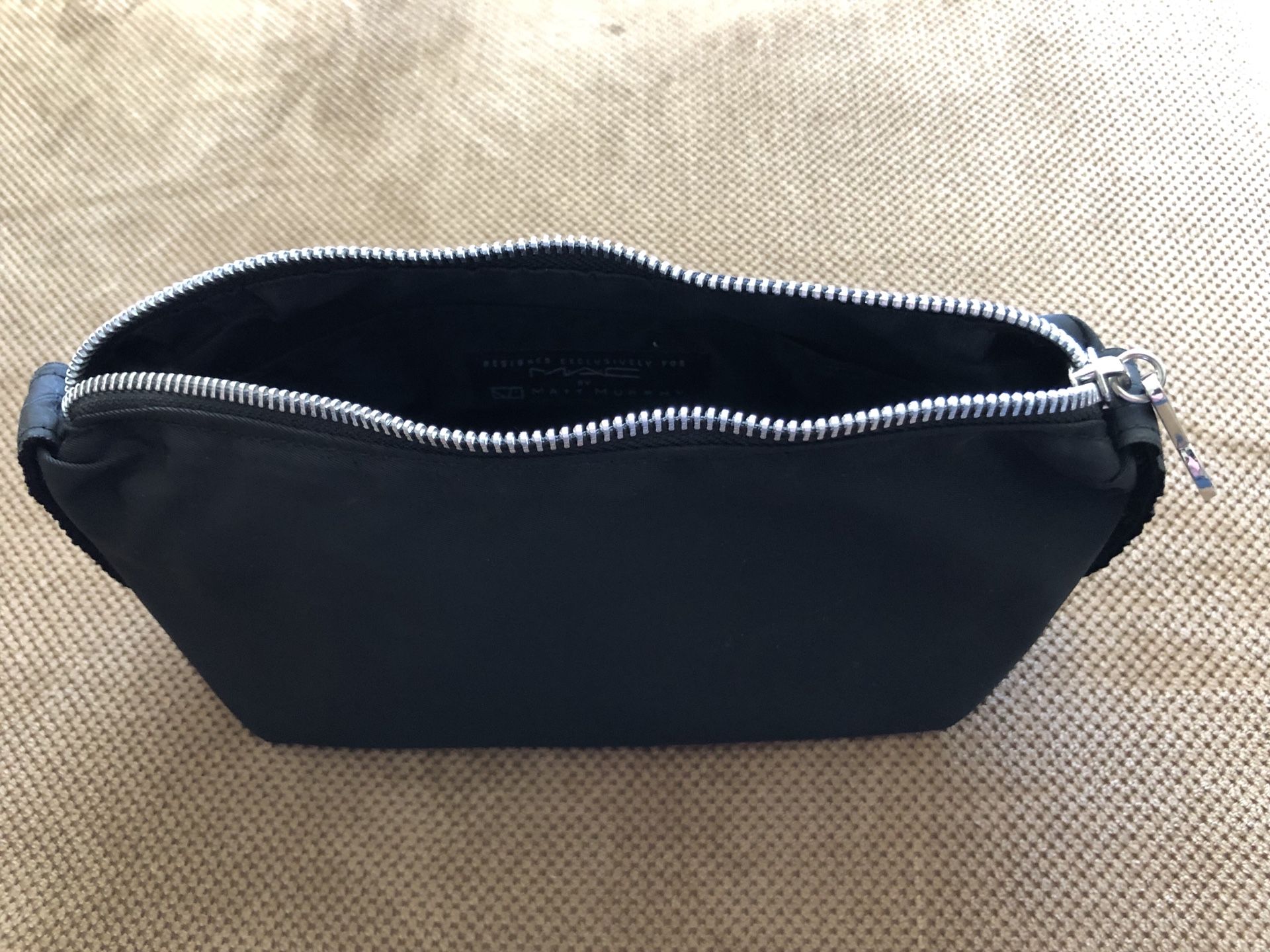 M.A.C makeup and LV cosmetic pouch