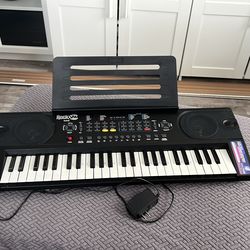 49 keyboard piano + Piano Book w lessons