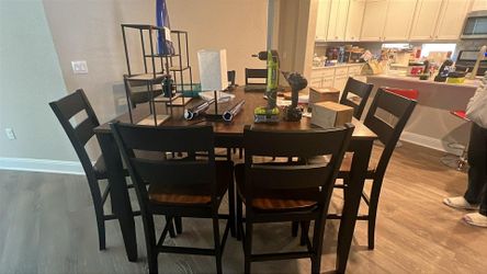 Tall dining room table with 8 chairs