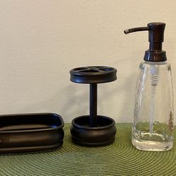 Glass and metal bathroom decor