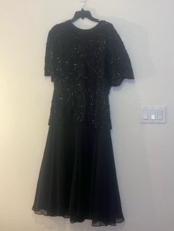 Holiday Bling ! Flare Dress in black with, black sequin discs and seed beads accents. Polyester  Worn once