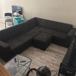 used couch. one rip in a cushion. one rip on the back cushion.
