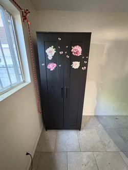 black 2-door IKEA wardrobe