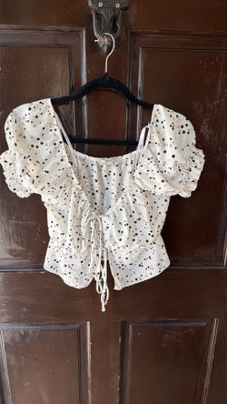 White polka dot shirt