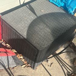 Black wicker storage ottoman