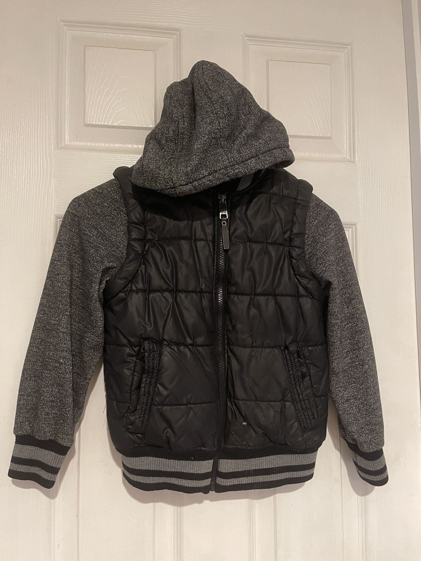 Size 7 black vest with built in hoodie by Urban Republic 