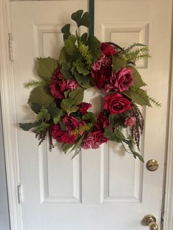 Maroon red rose wreath.