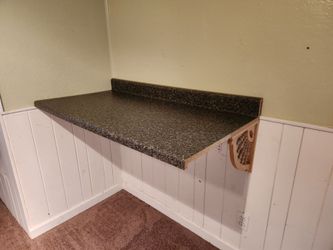 Laminated Countertop with a Backsplash that is greenish