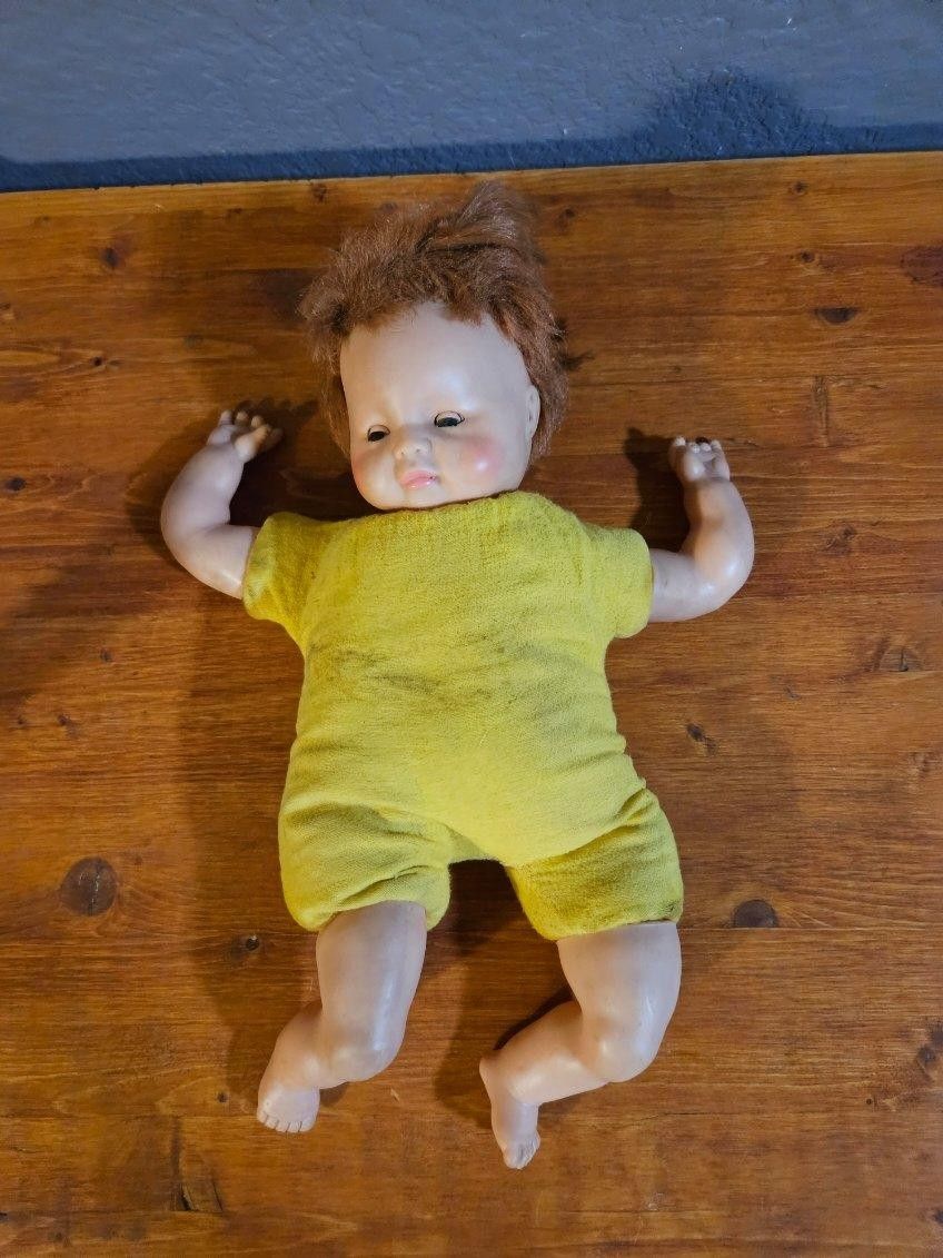 Eegee Plush Baby Doll 12EP 13-2 26 This Eegee's baby doll is a vintage collectible that stands at 14 inches tall. The doll is in great shape and has