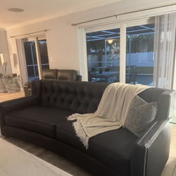 Two large navy blue sofas