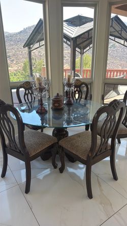 Dining table with a five chair set with the candle and vase nine pieces for sale