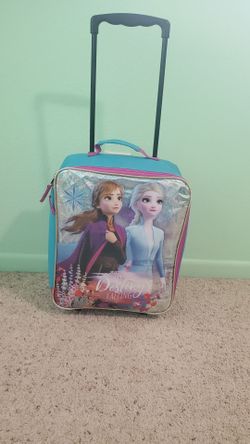 Girl rolling luggage