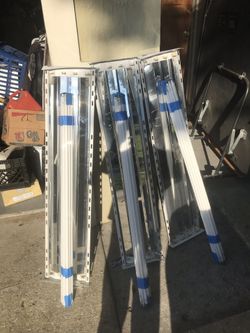 Fluorescent light fixtures with bulbs
