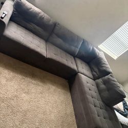 Grey sectional couch : will deliver 