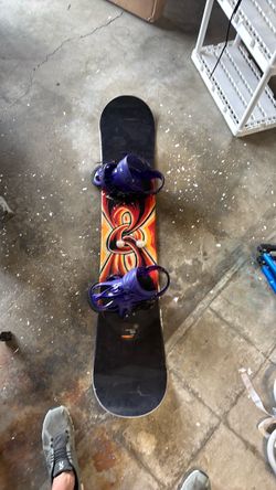 GNU Snowboard with Purple Bindings