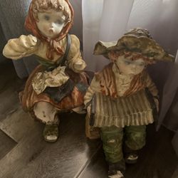 Antique dolls, a boy, and a girl