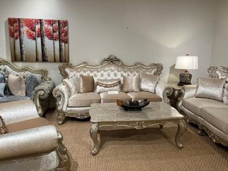  Elegant sofa with Champagne upholstery and wood accents.