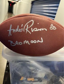 Authentic football signed by Andre “Bad Moon” Rison