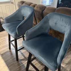 2 blue barstool chairs