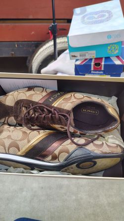 Women's Coach tennis  shoes in original box with papers,still like new ,7 and half