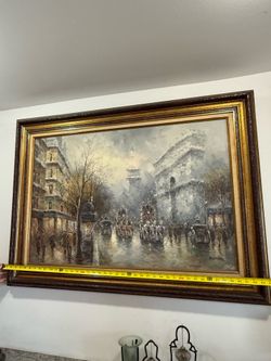 Johnny Gaston (British, bn. 1955), Parisian Street, with Arc de triomphe, after rain, signed, oil on canvas, 61cm x 91cm.
