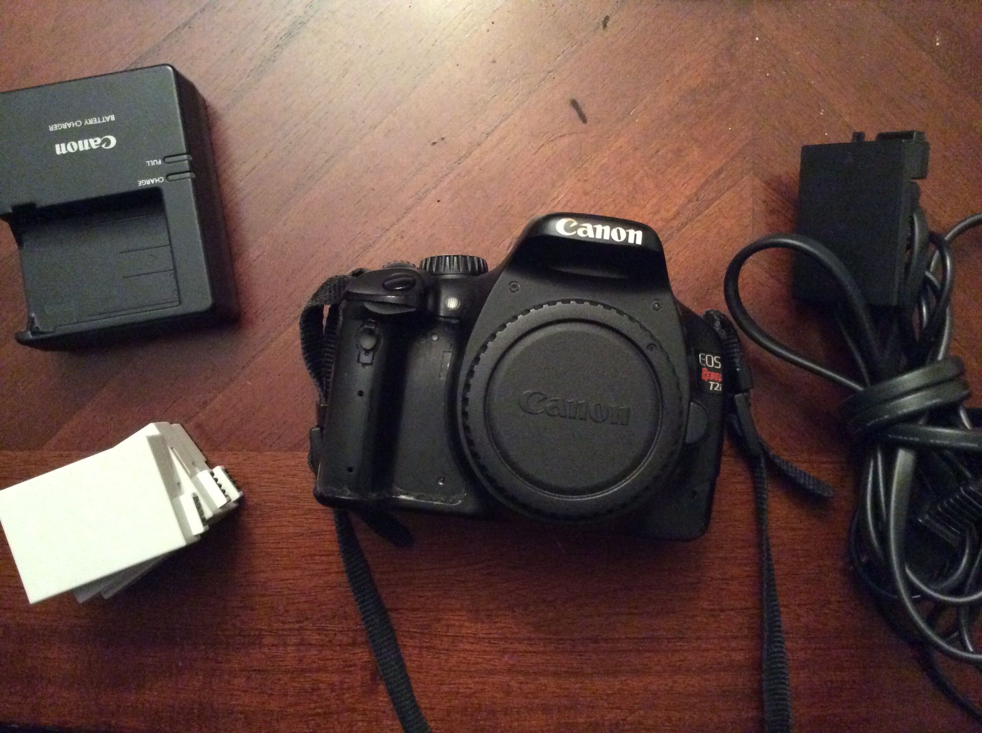 Canon Rebel T2i body with charger and wall adapter