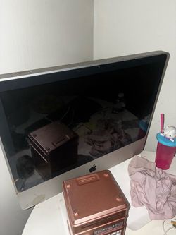 The main item is an Apple iMac desktop computer 🖥️ — an ol