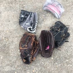 4  Practically New Fast Pitch Softball Gloves And 1 New Face Shield For Helmet 