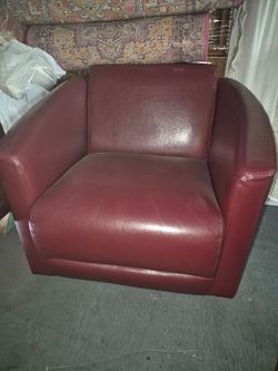 Red leather chair that swivels