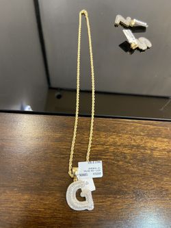 10k gold chain and real diamond pendant initial “G” for a good price!!