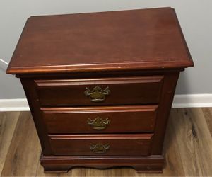 Wooden three drawer nightstand